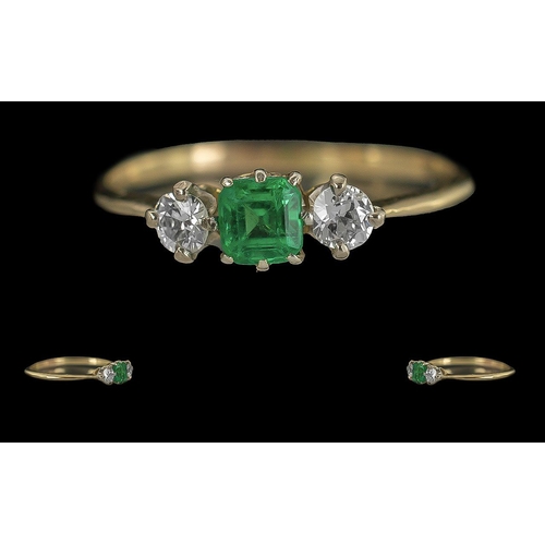 235 - Ladies 18ct Gold Attractive and Petite 3 Stone Emerald and Diamond Set Ring, Tests 18ct Gold. The Em... 