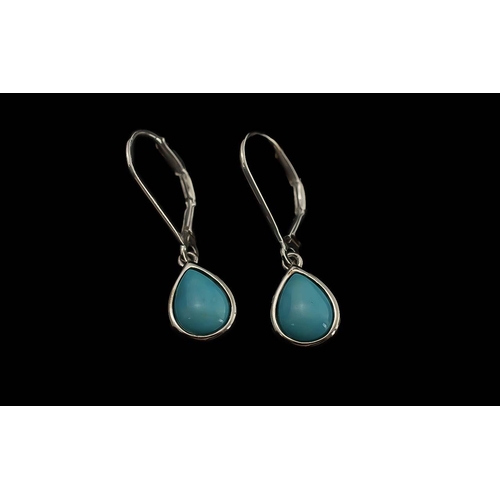 271 - Turquoise Pear Drop Earrings, each earring comprising a collet set, pear cut, turquoise cabochon set... 