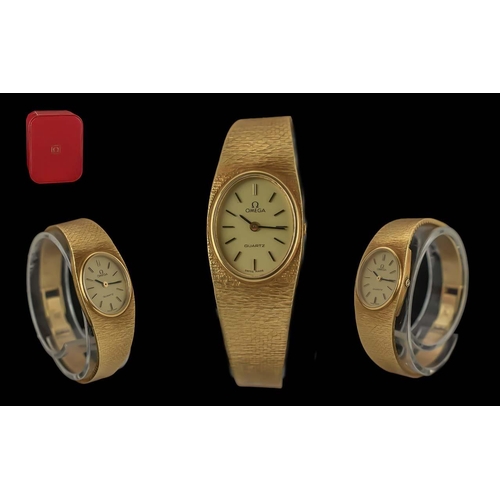 27A - Omega Ladies 18ct Gold Quartz Wrist Watch with Integral Bracelet. Marked 750 - 18ct. Hallmark for 19... 