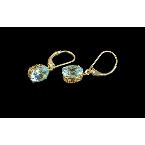 315 - Pair of Blue Topaz Drop Earrings, oval cut solitaires of sparkling blue topaz, each of over 2cts, su... 