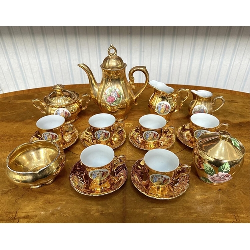 649 - Vintage Gilt Tea Set, comprising six cups and saucers, teapot, milk jug and creamer, lidded sugar bo... 