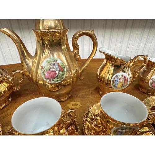 649 - Vintage Gilt Tea Set, comprising six cups and saucers, teapot, milk jug and creamer, lidded sugar bo... 