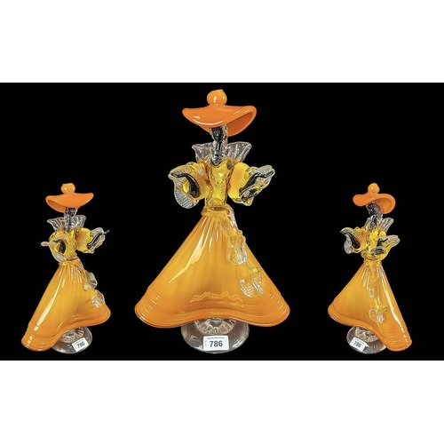 786 - Murano Studio Figure of an elegant lady, tangerine colour dress and hat.