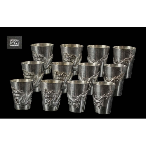 120 - Chinese Export Fine Set of 12 Drinking Tots.  Each decorated with the embossed image of a mythical f... 