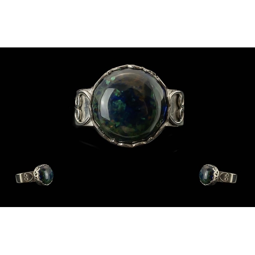 285A - Azurite Hand Made Ring, a round cut, 6.5ct, cabochon of the mottled mineral with a base colour of ro... 