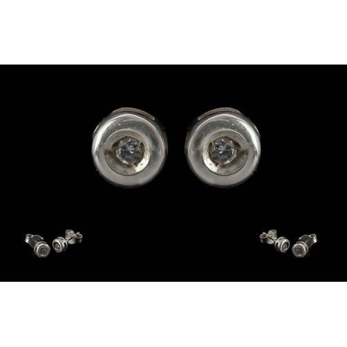 245 - 9ct White Metal Diamond Set Earrings, rub over setting.