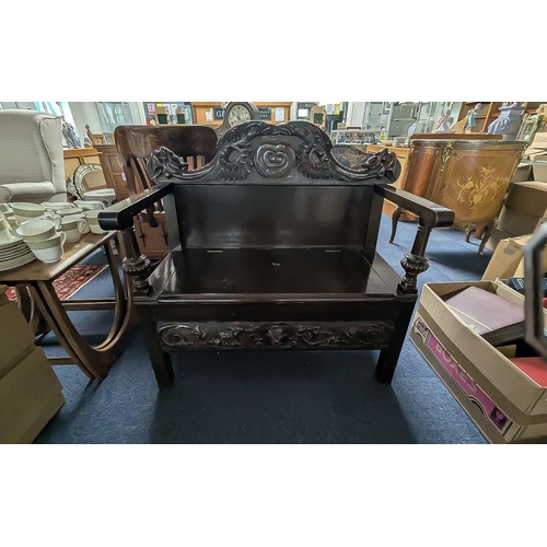 1025 - Small Monks Bench, with hinged seat, carved back rest, front and sides.  Height 35'', width 35'', de... 