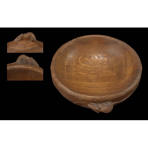 1020 - ROBERT THOMPSON OF KILBURN, A MOUSEMAN OAK NUT BOWL circular, the adzed exterior with small carved m... 