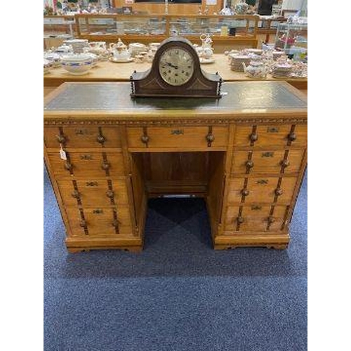 1043 - Twin Pedestal Oak Desk, with panelled back, leather top, two banks of three drawers and frieze drawe... 