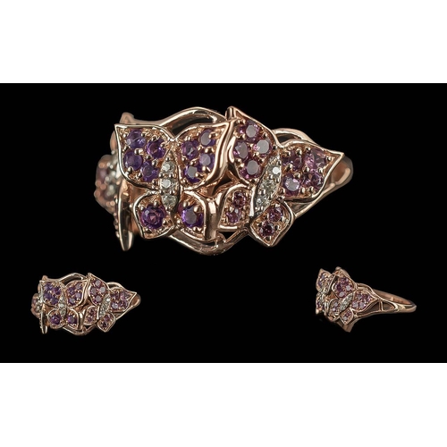 190 - Amethyst Butterfly Trio Ring, a beautifully 'sculpted' ring showing three 'butterflies' studded with... 