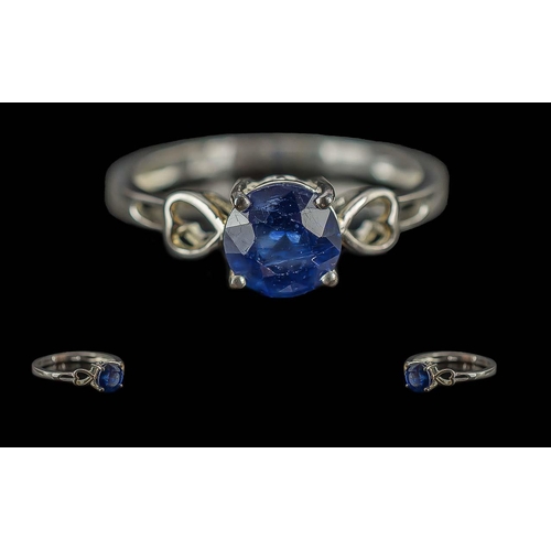 195 - Blue Sapphire Solitaire and Hearts Ring, a round cut sapphire of good colour, measuring 1.25cts, set... 