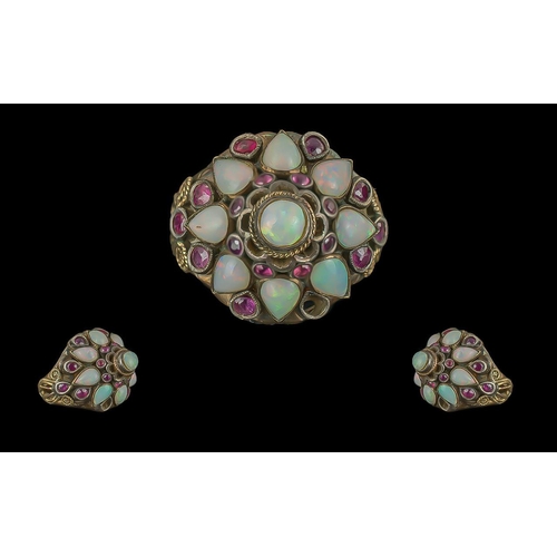 288 - 14ct Gold Opal & Ruby Coloured Bombe Shaped Ring, stamped 14 ct to interior, set with tear drop shap... 