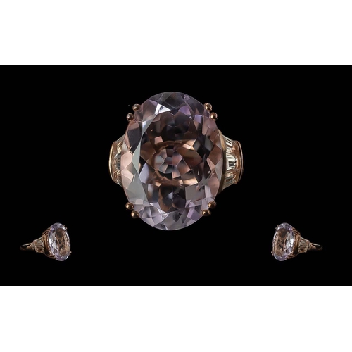 308 - Amethyst and White Topaz Ring, the oval cut amethyst measuring 20mm x 15 and 16cts, an exceptional s... 