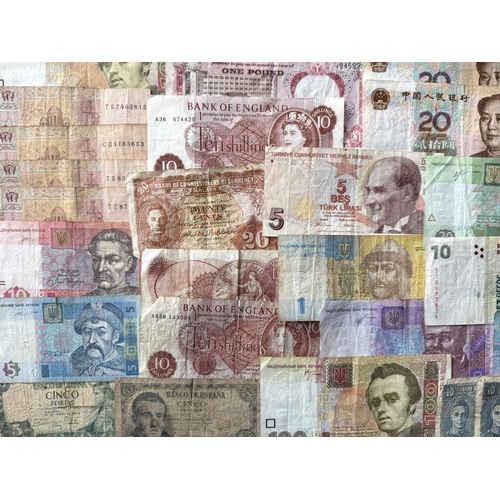 450 - A Collection of Banknotes From Around The World, to include 200,00 Zimbabwe Dollars, £1 Bank of Nige... 