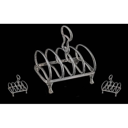 107 - Fine Quality Victorian Sterling Silver Four Tier Toast Rack of pleasing form, supported on 4 webbed ... 