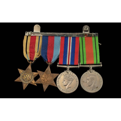 1313 - WWII Interest - Collection of Four WWII Medals, on bar with ribbons, comprising The Defence Medal, 1... 