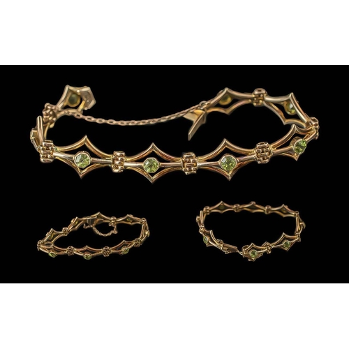 30 - Antique Period Ladies Well Designed 9ct Gold Peridot Set Bracelet with Safety Chain, Marked 9ct. The... 