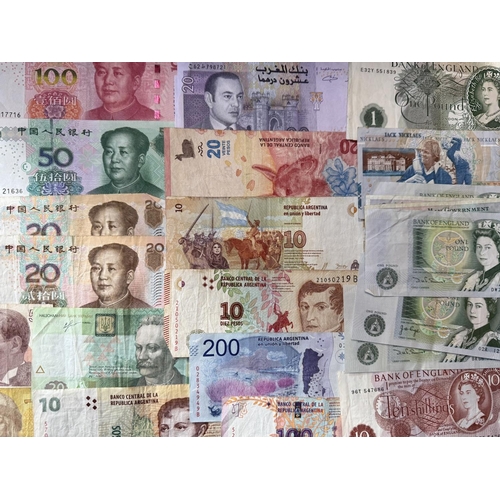 450A - A Collection of Banknotes From Around The World, to include 200,00 Zimbabwe Dollars, £1 Bank of Nige... 