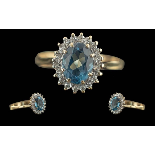 53A - Ladies 9ct Gold Blue Topaz And Diamond Set Cluster Ring - full hallmark to interior of shank. The ce... 