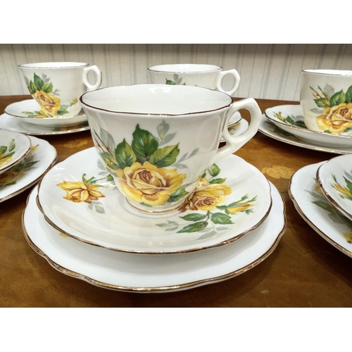 657 - Royal Staffordshire Rose Pattern Tea Set, comprising six trios of cup, saucer and side plate.  Yello... 