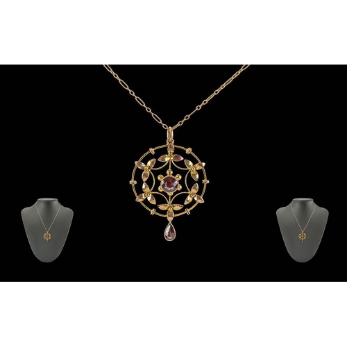 65A - Edwardian Period 1901 - 1910 Ladies 9ct Gold Openwork Circular Garnet Set Pendant with 9ct gold chai... 