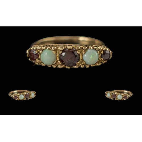 92 - Ladies Attractive 9ct Gold Opal and Garnet Set Ring with ornate setting, full hallmark to interior o... 