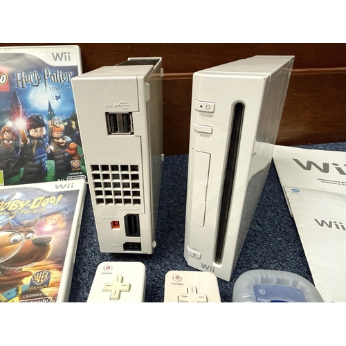 1452 - Nintendo Wii Gaming System, Wii Fit with power supply and spare batteries.