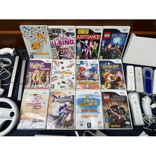 1452 - Nintendo Wii Gaming System, Wii Fit with power supply and spare batteries.