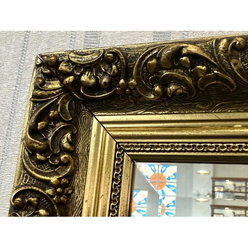 1040 - Large Ornamental Mirror, with engraved horse and carriage, gilt framed, measures overall 27'' x 38''... 