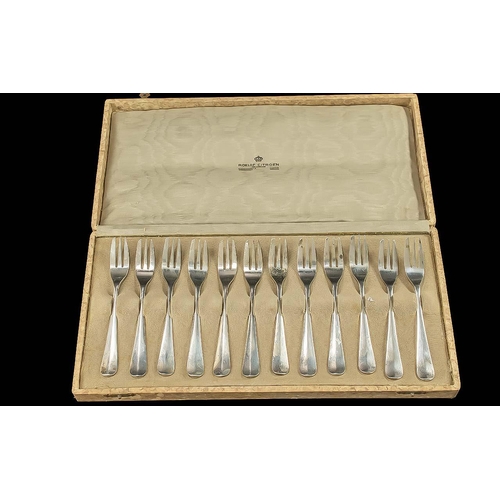 128 - Cased Set of Twelve Silver Continental Cake Forks, continental marks 900 purity.