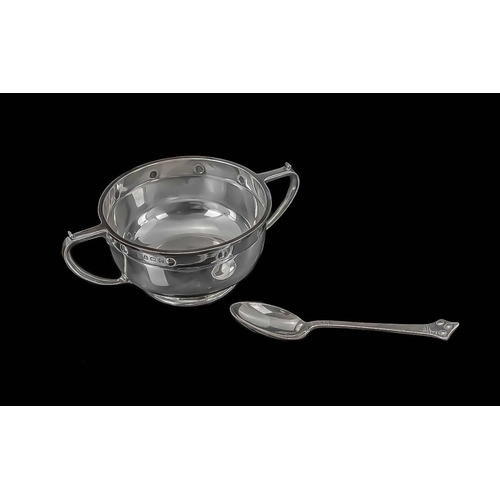 132 - Arts & Crafts Style Twin Handled Loving Cup, hallmarked Birmingham C. and associated spoon.  In fitt... 