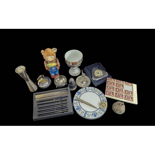 1426 - Box of Collectibles, comprising a set of ballpoint pens, a ring holder, a vintage wind up toy of a b... 