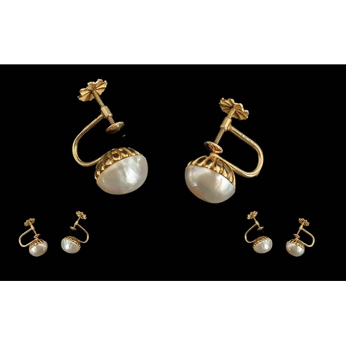 357 - Pair of 18ct Gold Pearl Earrings with screw backs, pearl diameter 10 mm.  Gross weight 5 grams.