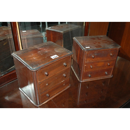 144 - Pair of miniature chests of drawers