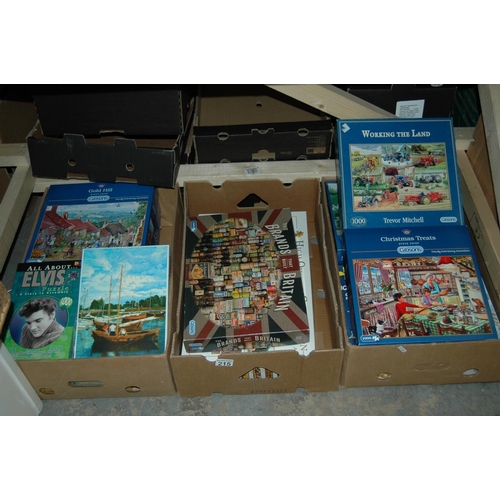 215 - 3 boxes of puzzles