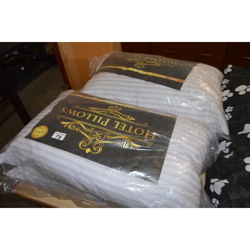 79 - 4 NEW hotel pillows