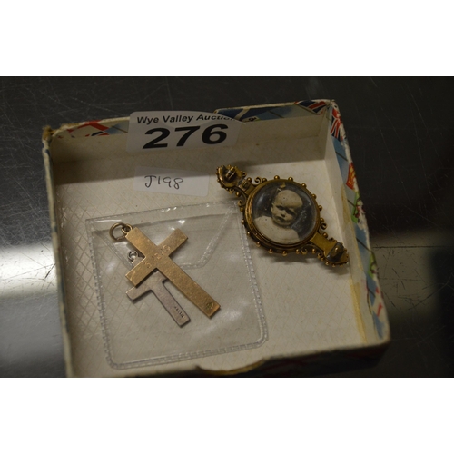 276 - 2 crucifixes (1 silver 1 gold) & yellow metal brooch