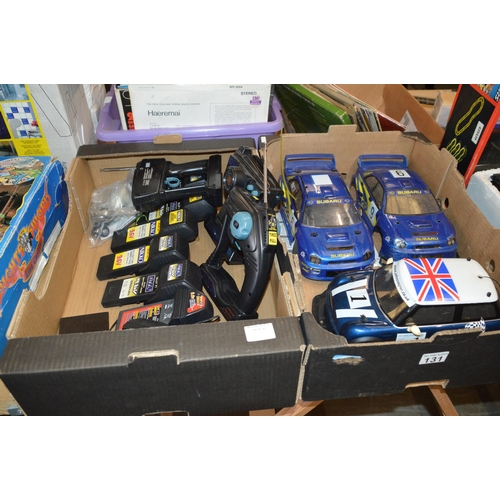 131 - 2 boxes of radio controlled cars etc