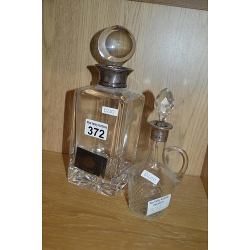 372 - 2 glass decanters with silver collars