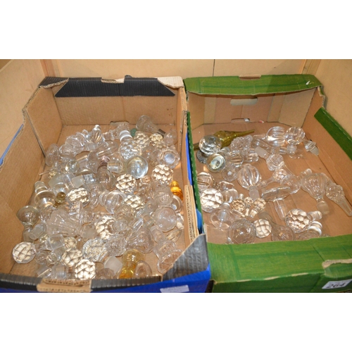 264 - 2 boxes of glass stoppers