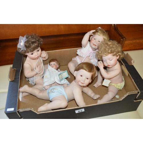 82 - Box of china dolls