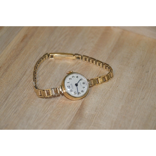 450 - Avia cocktail watch, 9ct gold case & strap