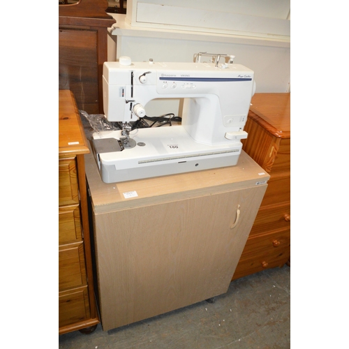 180 - Husqvarna sewing machine & cabinet