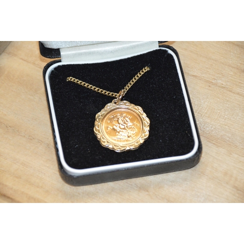 344 - Half sovereign in 9ct gold mount with chain