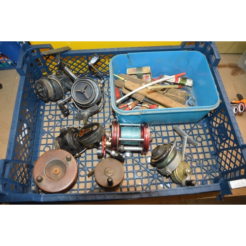 91 - basket of fishing reels etc