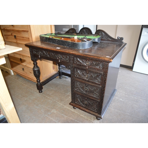 168 - carved oak desk