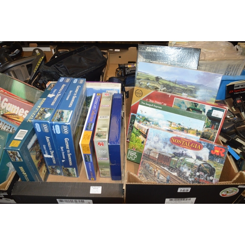 169 - 2 boxes of puzzles