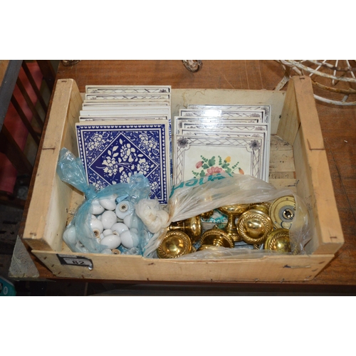 82 - crate of tiles & door knobs