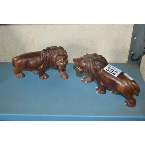 392 - 2 carved wood lions