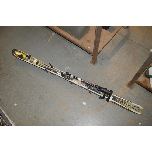 79 - pair of downhill skis including poles